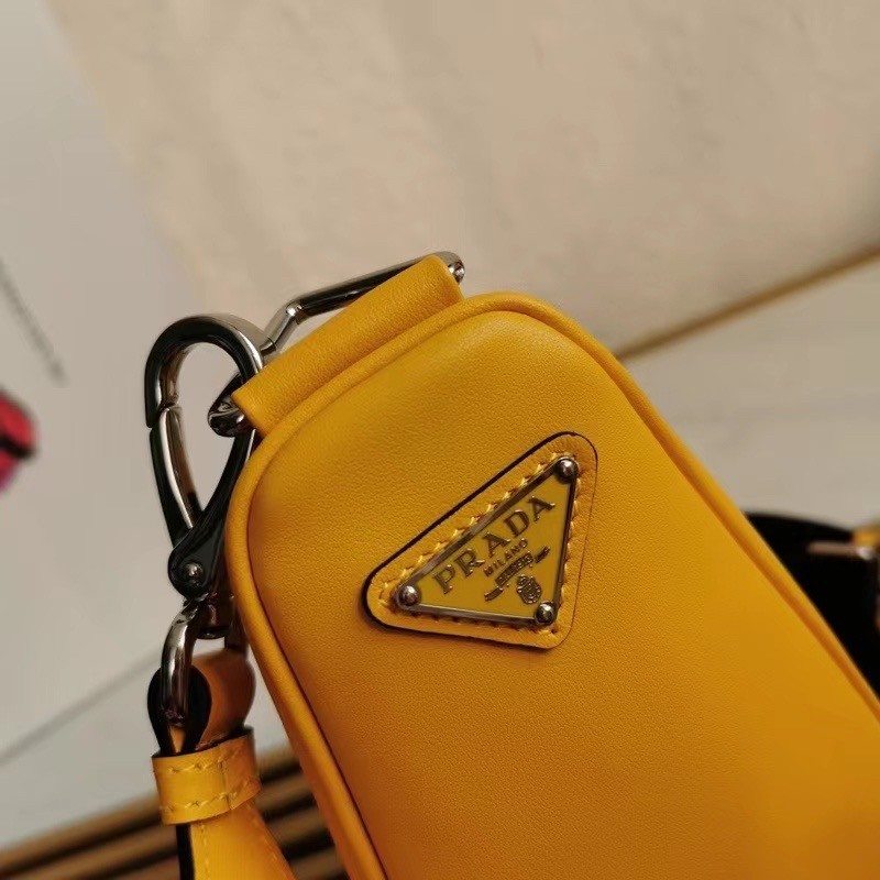 Pra*a triangle shoulder bag in yellow leather