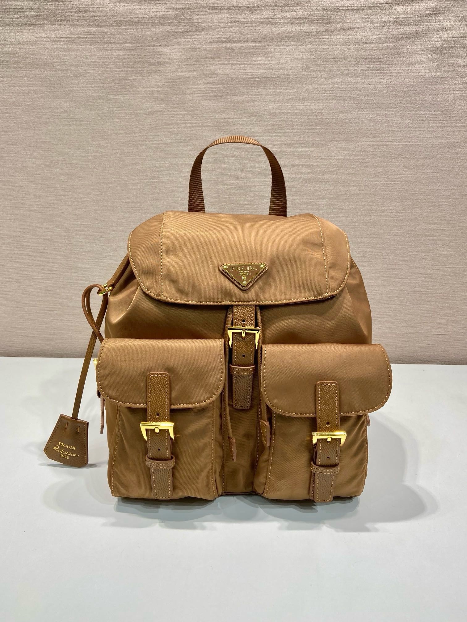 Pra*a re-edition 1978 small backpack in brown re-nylon