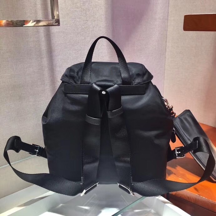 Pra*a black nylon backpack with clutch
