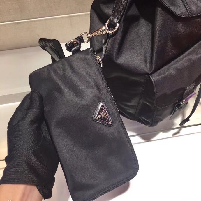 Pra*a black nylon backpack with clutch