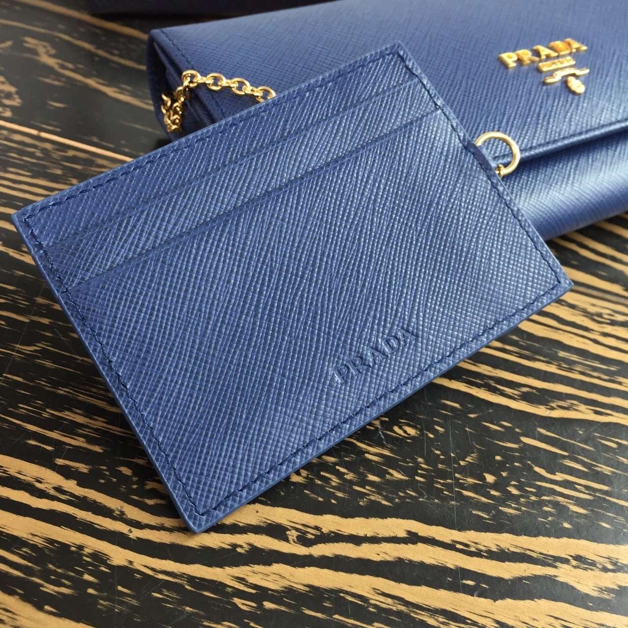 Pra*a continental wallet in blue saffiano leather