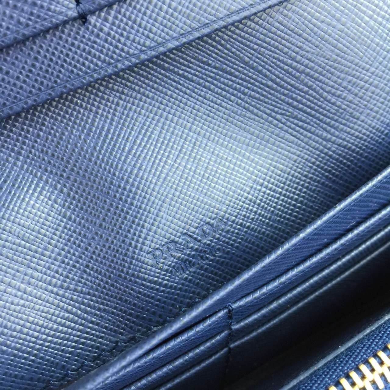 Pra*a continental wallet in blue saffiano leather