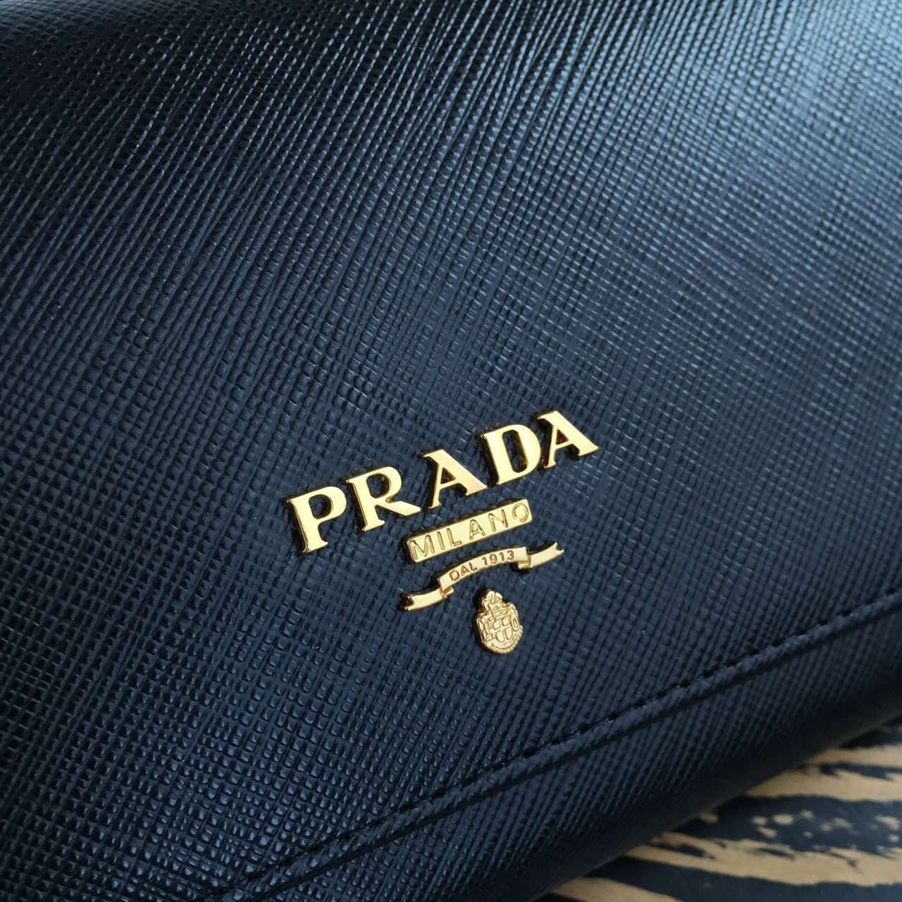 Pra*a continental wallet in black saffiano leather