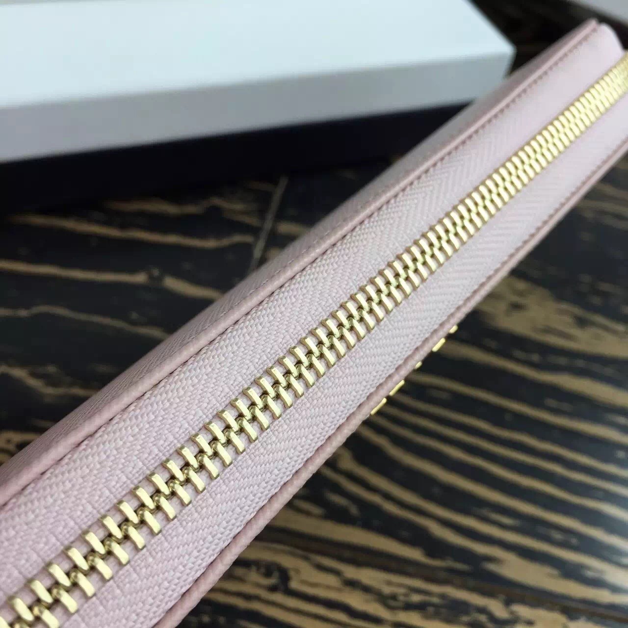 Pra*a zipped wallet in light pink saffiano leather