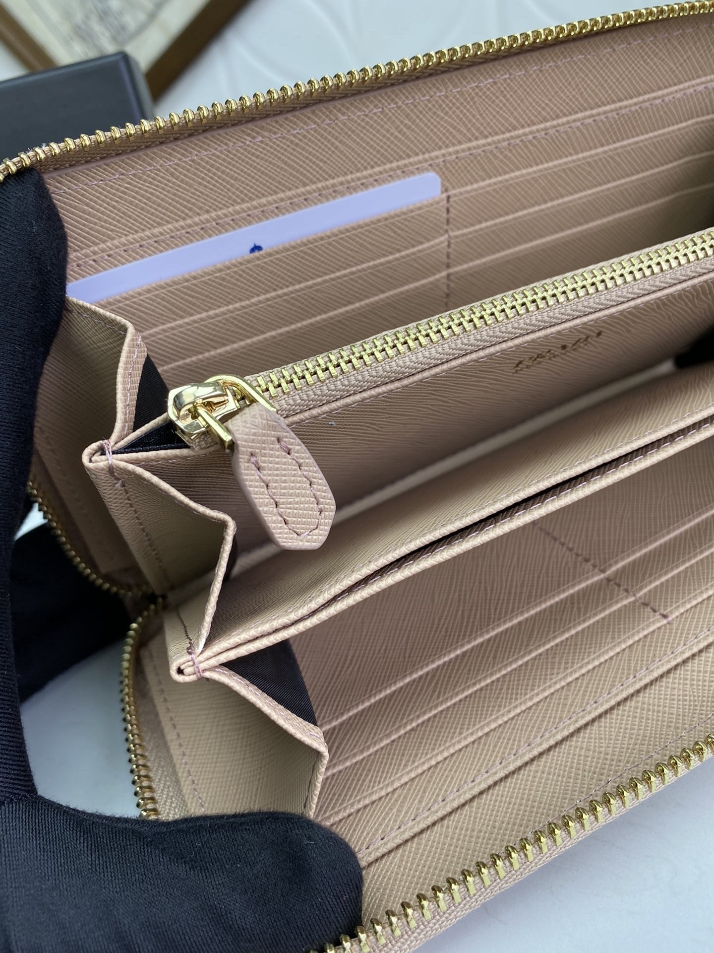 Pra*a zip around wallet in powder pink saffiano calfskin