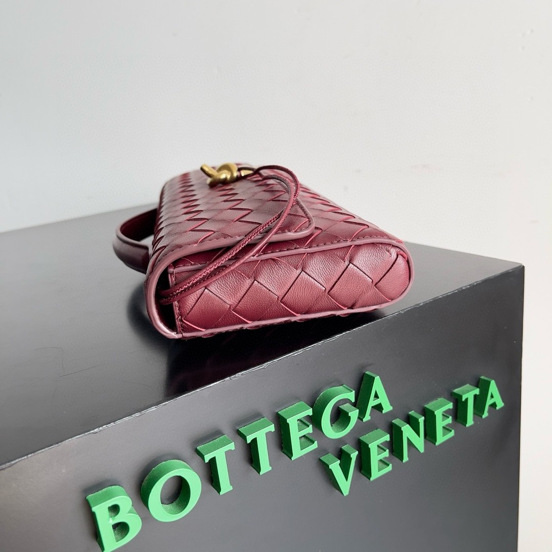 bo*te*ga Ve*ne*ta andiamo clutch with handle in barolo intrecciato lambskin
