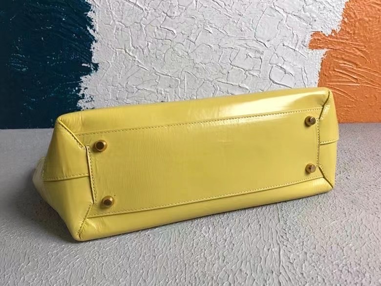 bo*te*ga Ve*ne*ta arco medium bag in mirabelle intrecciato leather