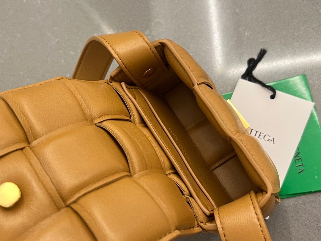 bo*te*ga Ve*ne*ta candy padded cassette bag in camel lambskin