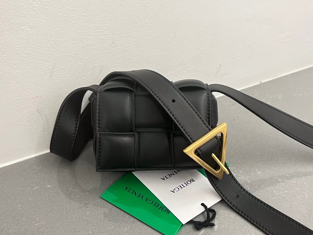 bo*te*ga Ve*ne*ta candy padded cassette bag in black lambskin