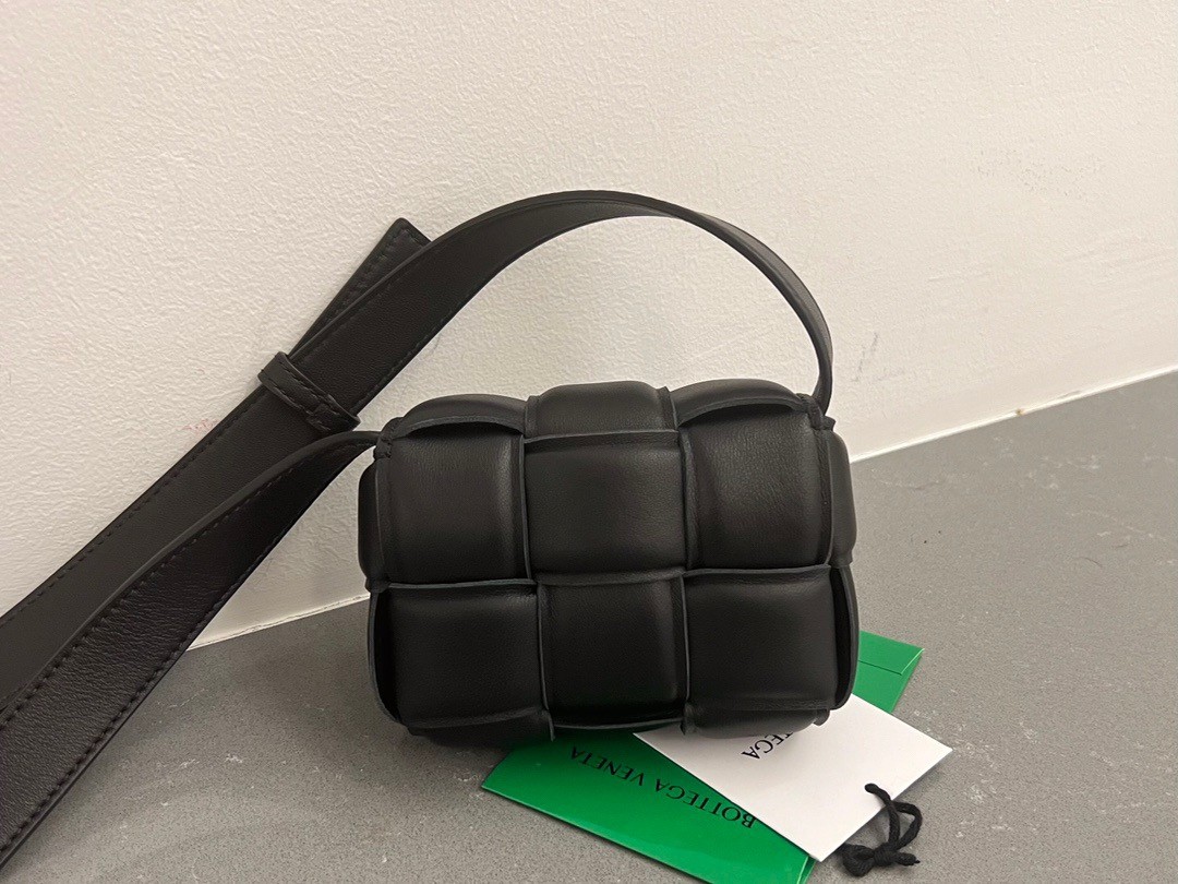 bo*te*ga Ve*ne*ta candy padded cassette bag in black lambskin