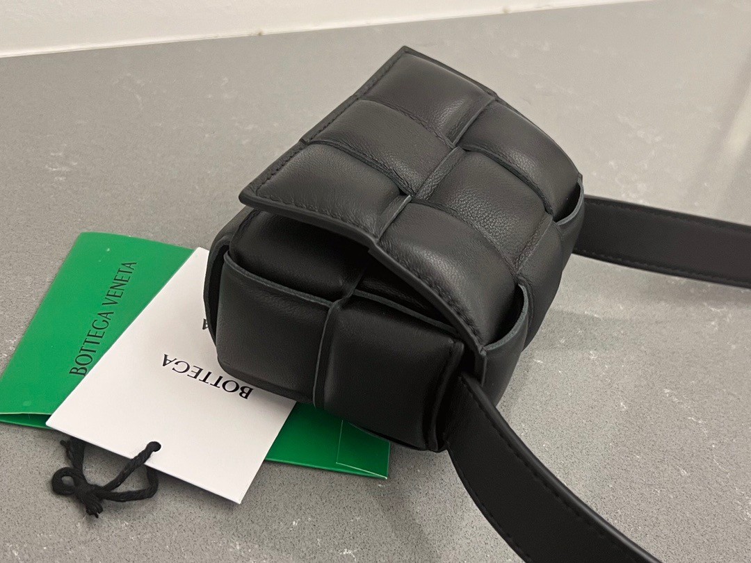 bo*te*ga Ve*ne*ta candy padded cassette bag in black lambskin
