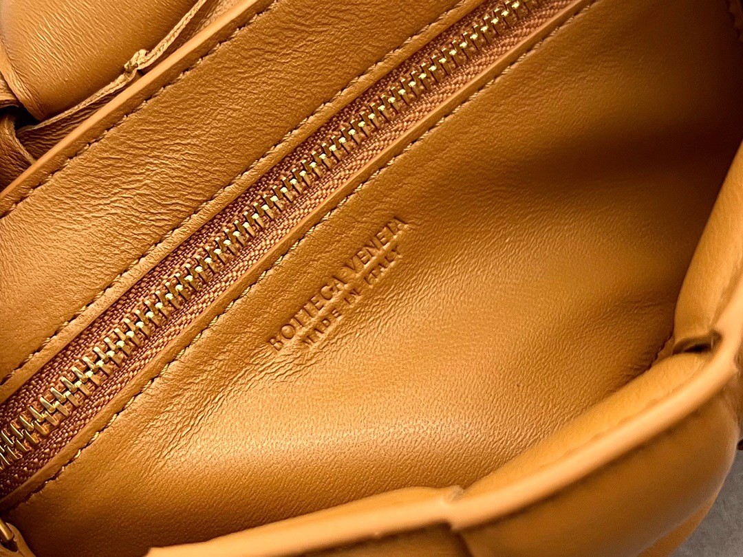 bo*te*ga Ve*ne*ta small padded cassette bag in camel lambskin