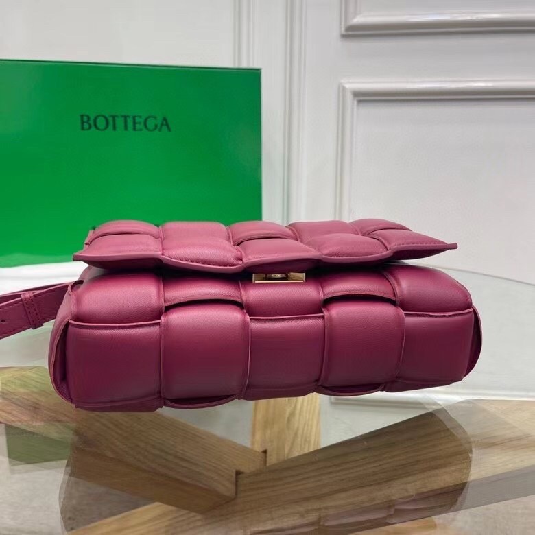 bo*te*ga Ve*ne*ta padded cassette bag in cinnabar calfskin
