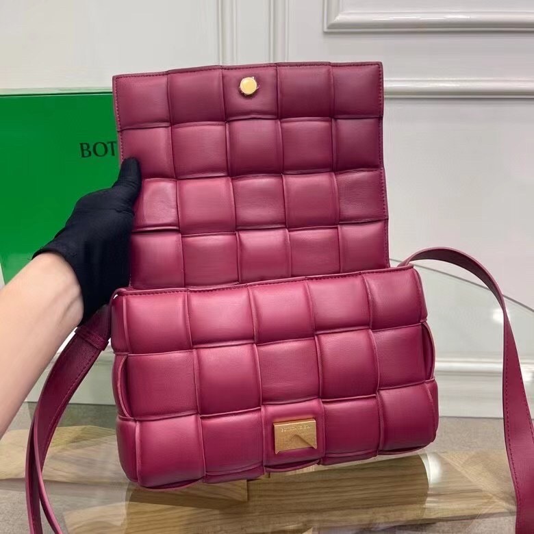 bo*te*ga Ve*ne*ta padded cassette bag in cinnabar calfskin