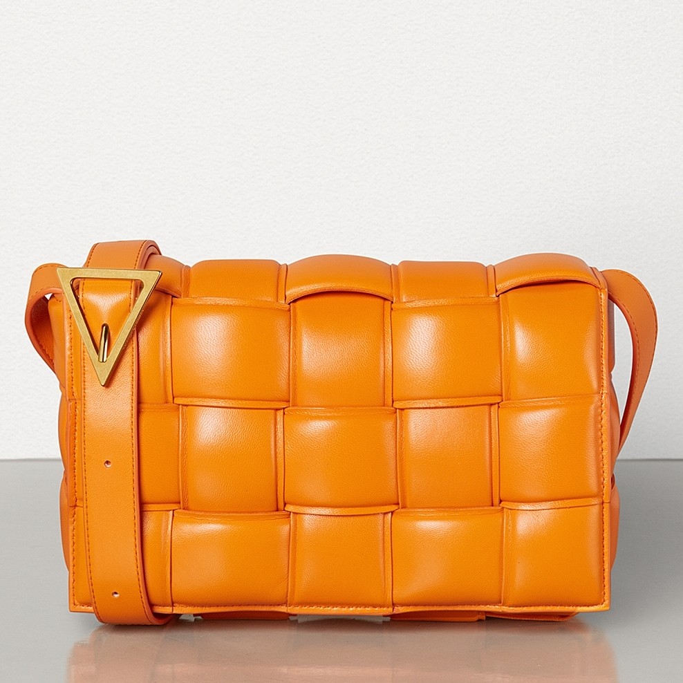 bo*te*ga Ve*ne*ta padded cassette bag in orange calfskin
