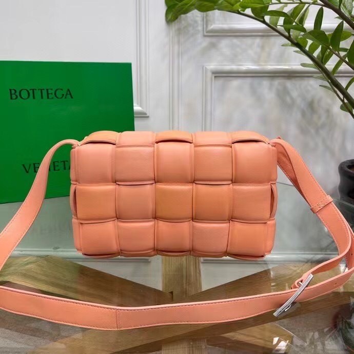 bo*te*ga Ve*ne*ta padded cassette bag in peachy calfskin
