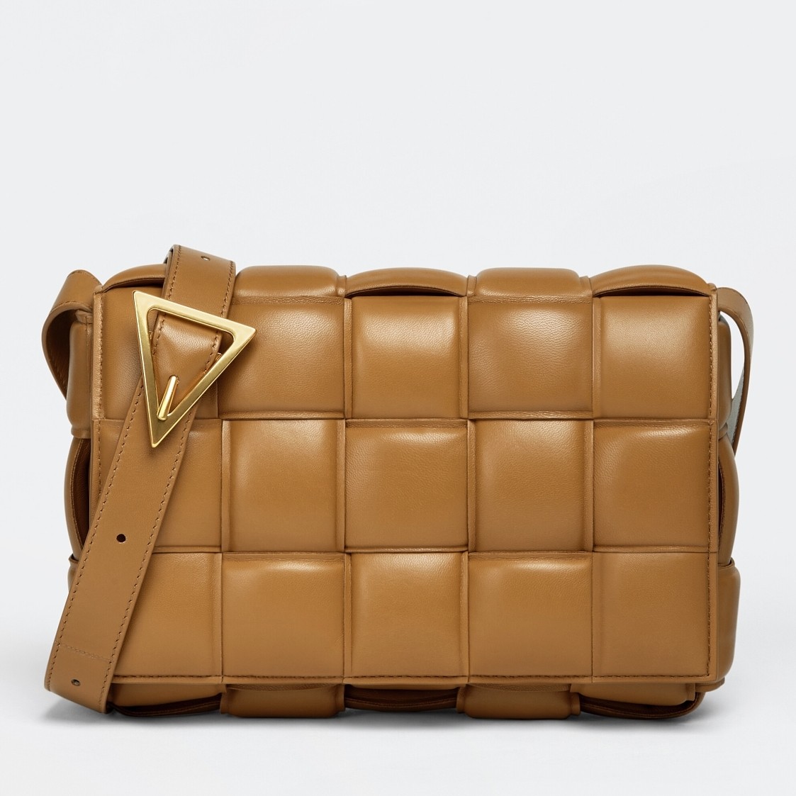 bo*te*ga Ve*ne*ta padded cassette bag in caramel lambskin