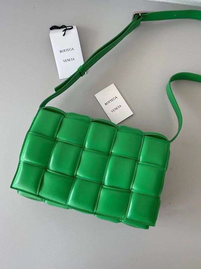 bo*te*ga Ve*ne*ta padded cassette bag in green lambskin