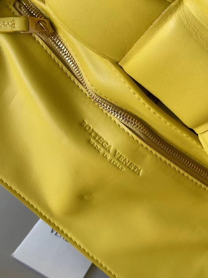 bo*te*ga Ve*ne*ta padded cassette bag in yellow lambskin