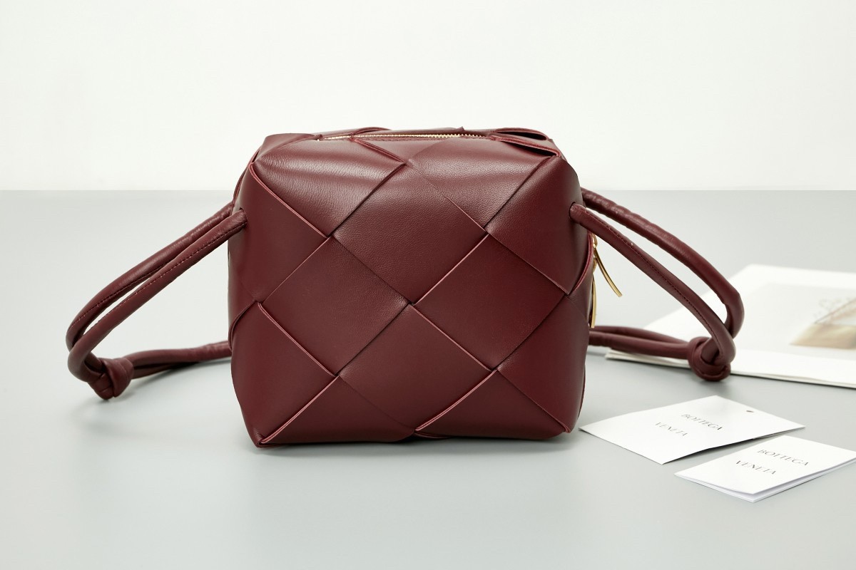 bo*te*ga Ve*ne*ta mini cassette camera bag in bordeaux lambskin
