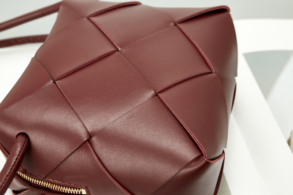 bo*te*ga Ve*ne*ta mini cassette camera bag in bordeaux lambskin