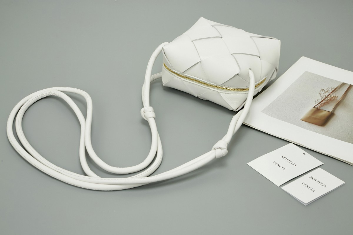 bo*te*ga Ve*ne*ta mini cassette camera bag in white lambskin