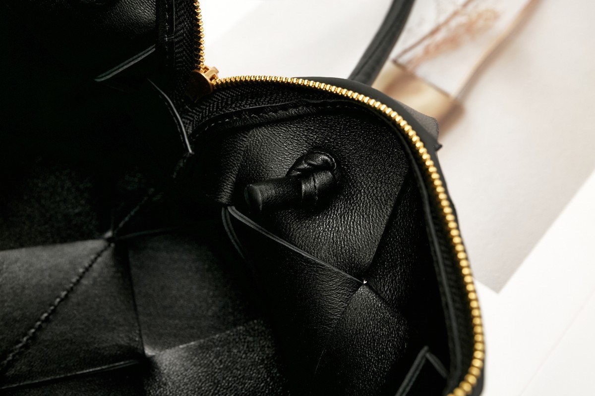bo*te*ga Ve*ne*ta small cassette camera bag in black lambskin