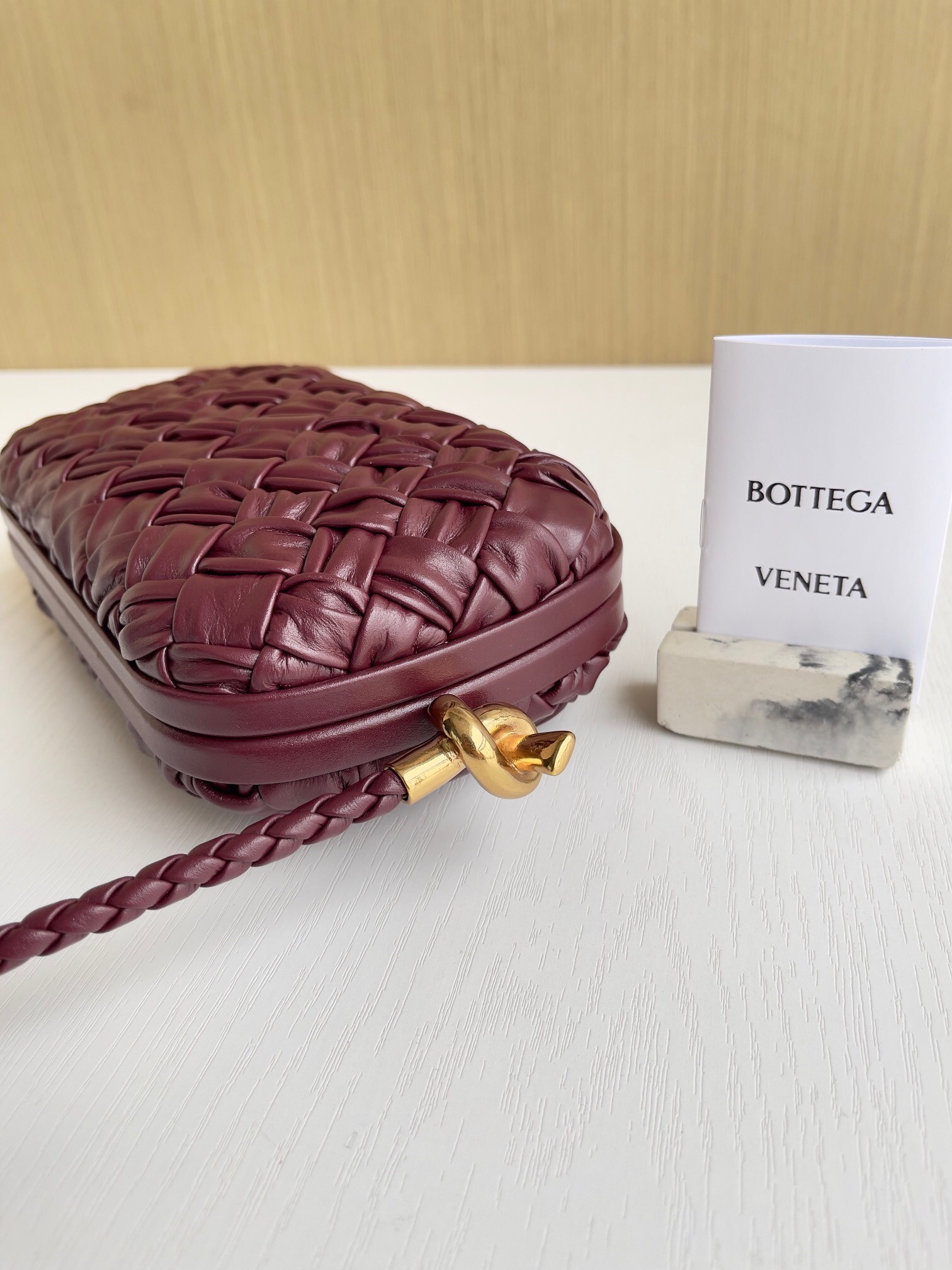 bo*te*ga Ve*ne*ta knot minaudiere on strap in barolo foulard intreccio leather