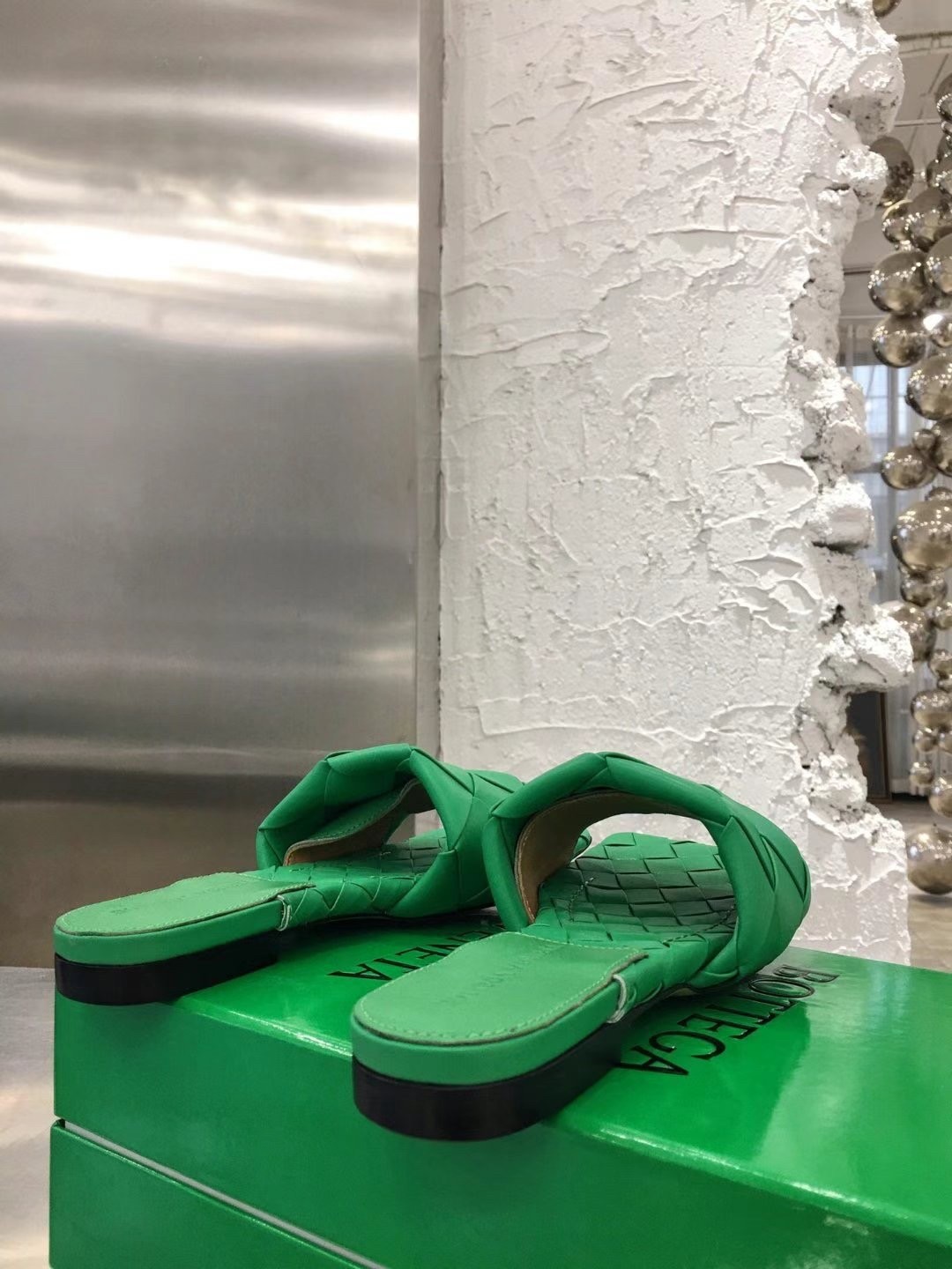 bo*te*ga Ve*ne*ta lido slides in green intreccio lambskin