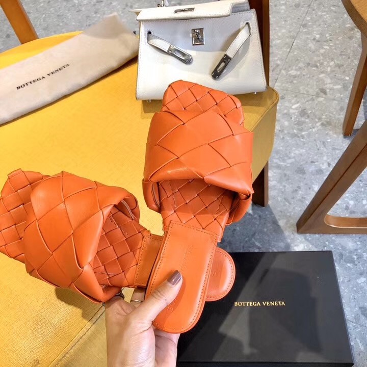 bo*te*ga Ve*ne*ta lido slides in orange intreccio lambskin