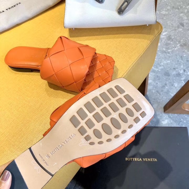 bo*te*ga Ve*ne*ta lido slides in orange intreccio lambskin