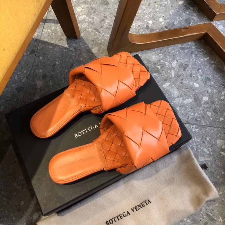 bo*te*ga Ve*ne*ta lido slides in orange intreccio lambskin