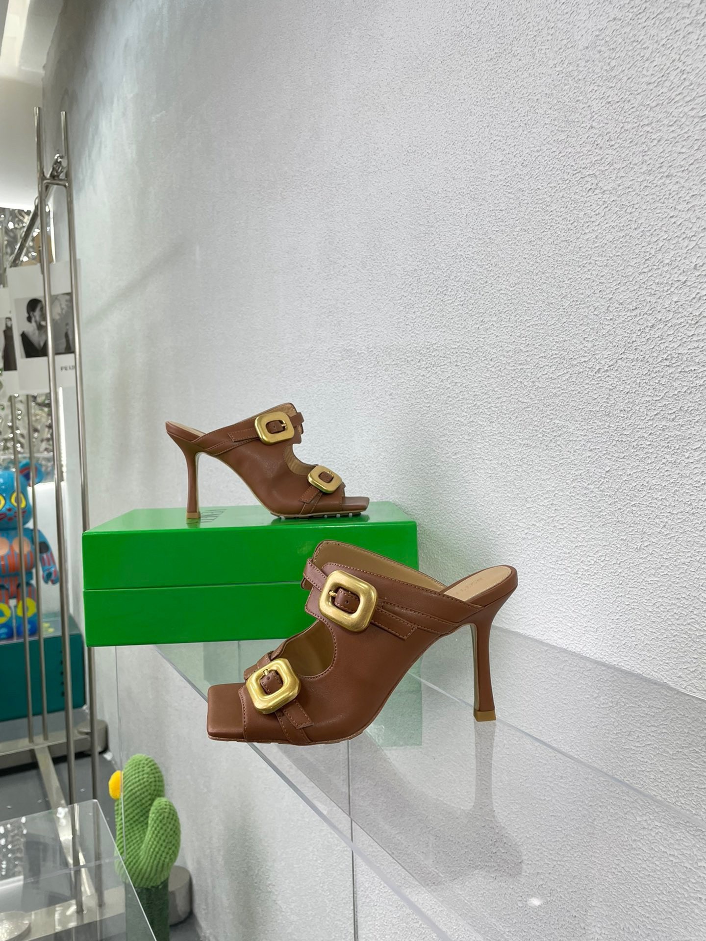 bo*te*ga Ve*ne*ta stretch buckle mules in caramel calfskin