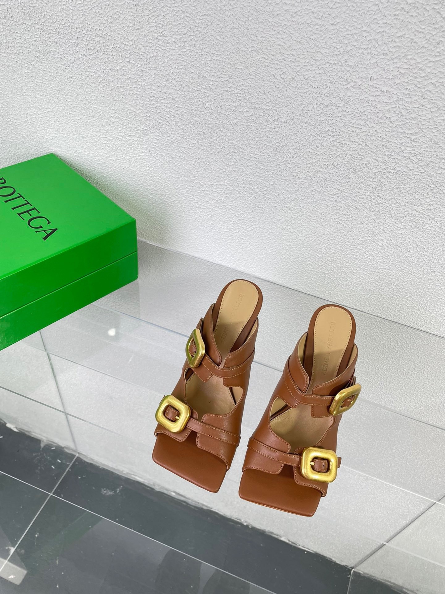 bo*te*ga Ve*ne*ta stretch buckle mules in caramel calfskin