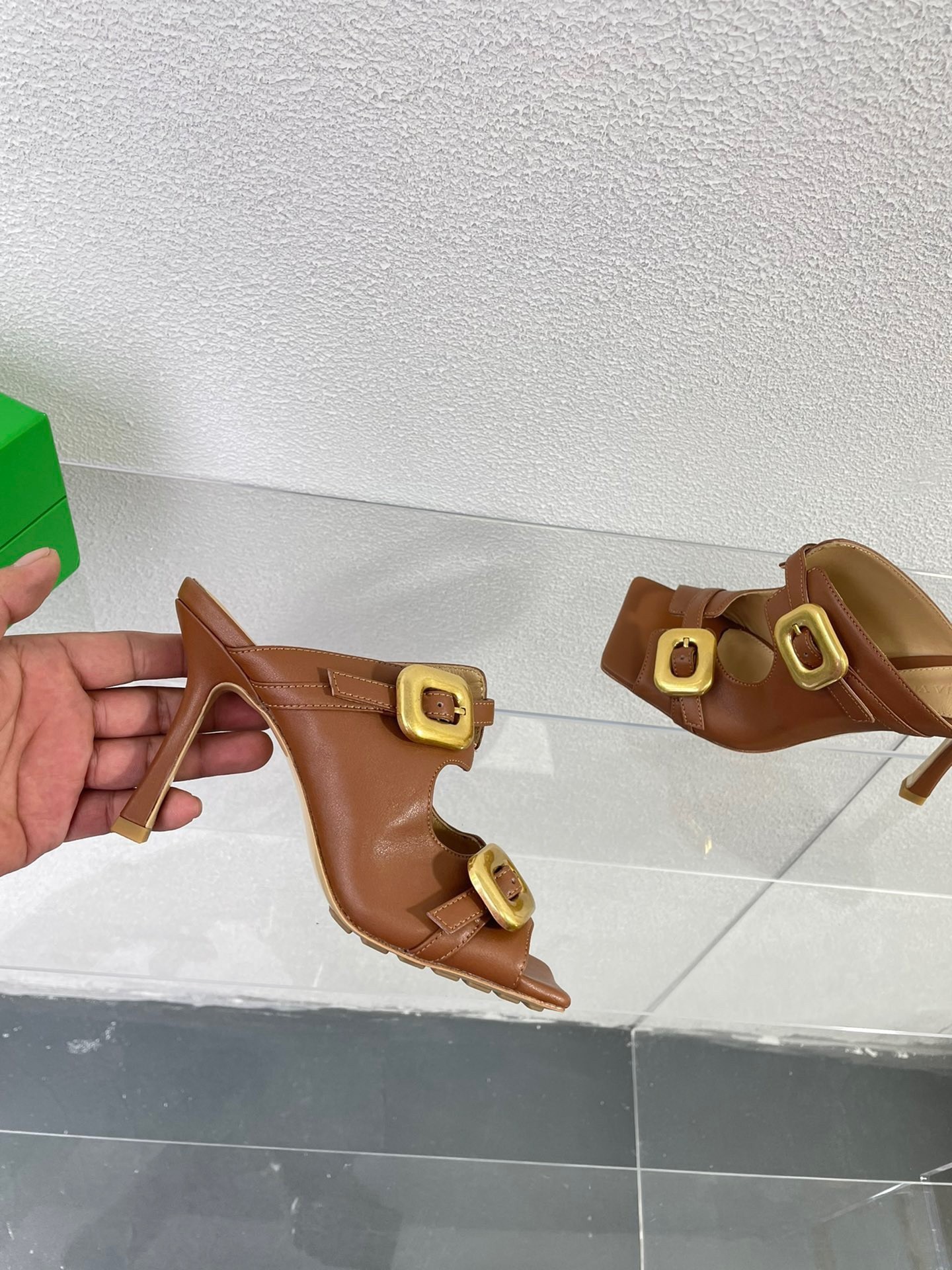 bo*te*ga Ve*ne*ta stretch buckle mules in caramel calfskin