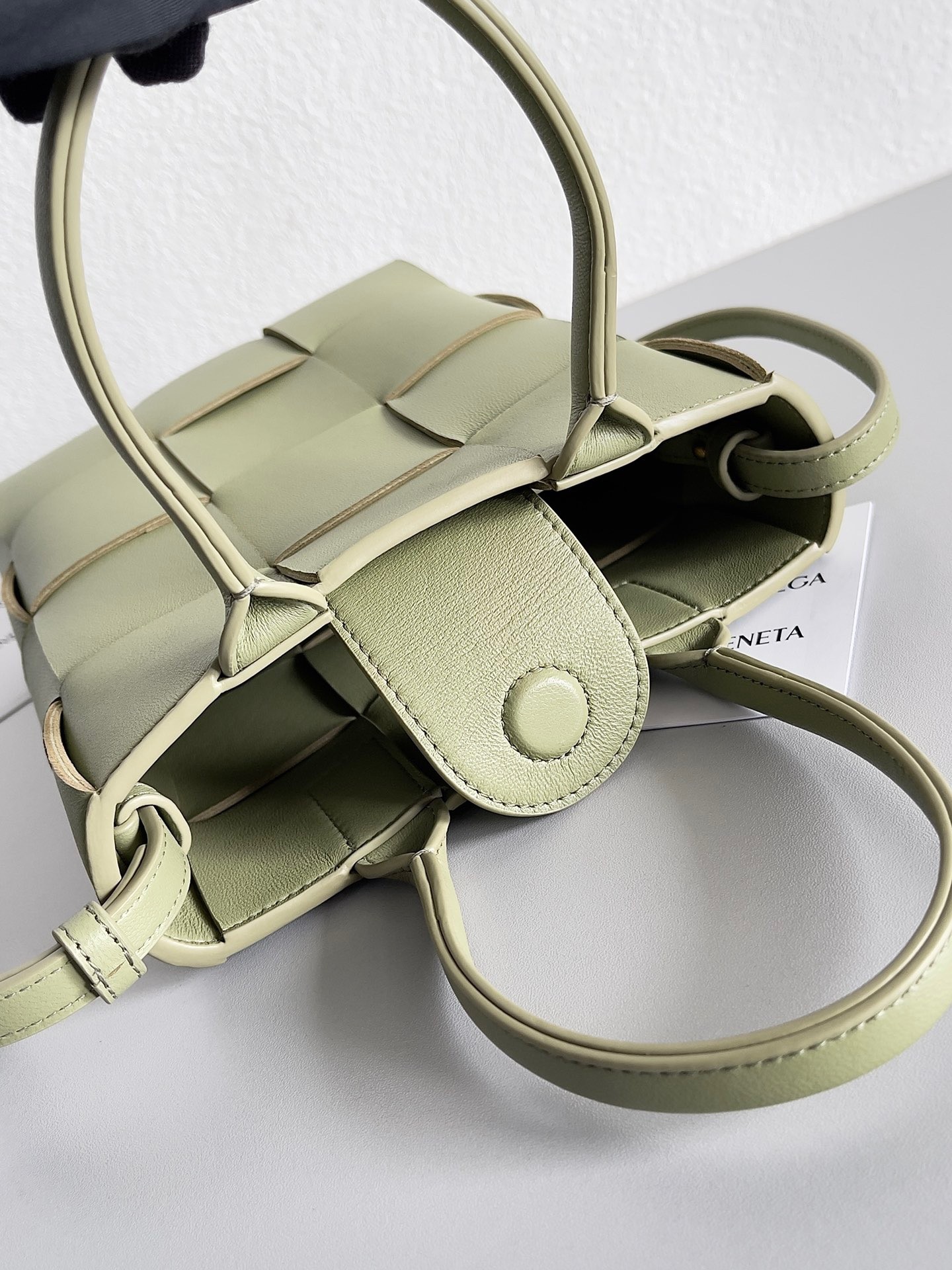 bo*te*ga Ve*ne*ta mini cassette tote bag in travertine lambskin
