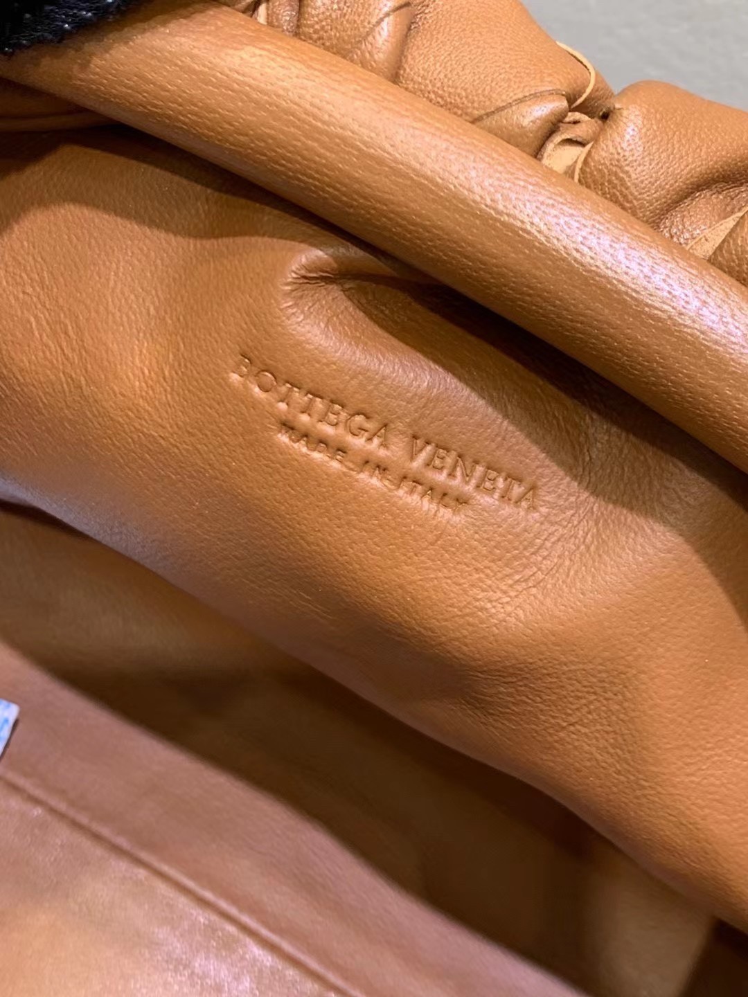 bo*te*ga Ve*ne*ta mini pouch in caramel intrecciato lambskin