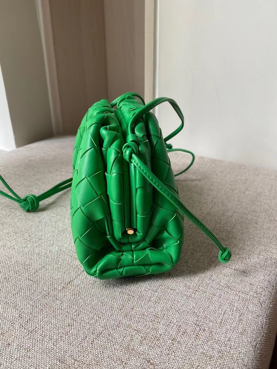 bo*te*ga Ve*ne*ta mini pouch in green intrecciato lambskin