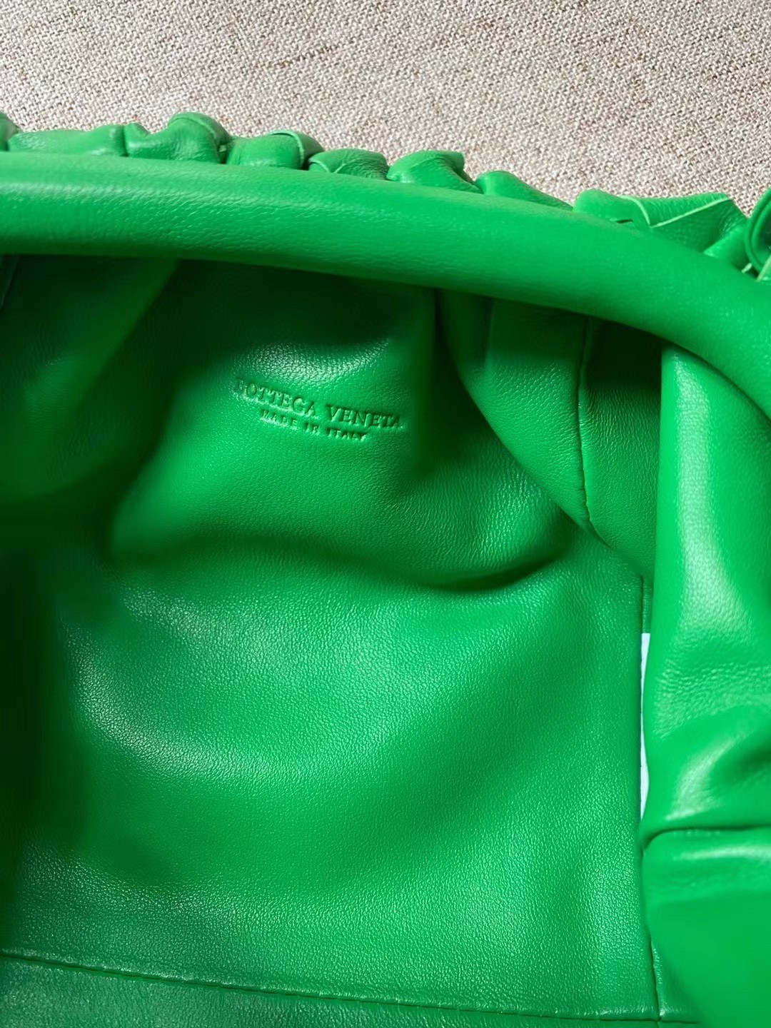 bo*te*ga Ve*ne*ta mini pouch in green intrecciato lambskin