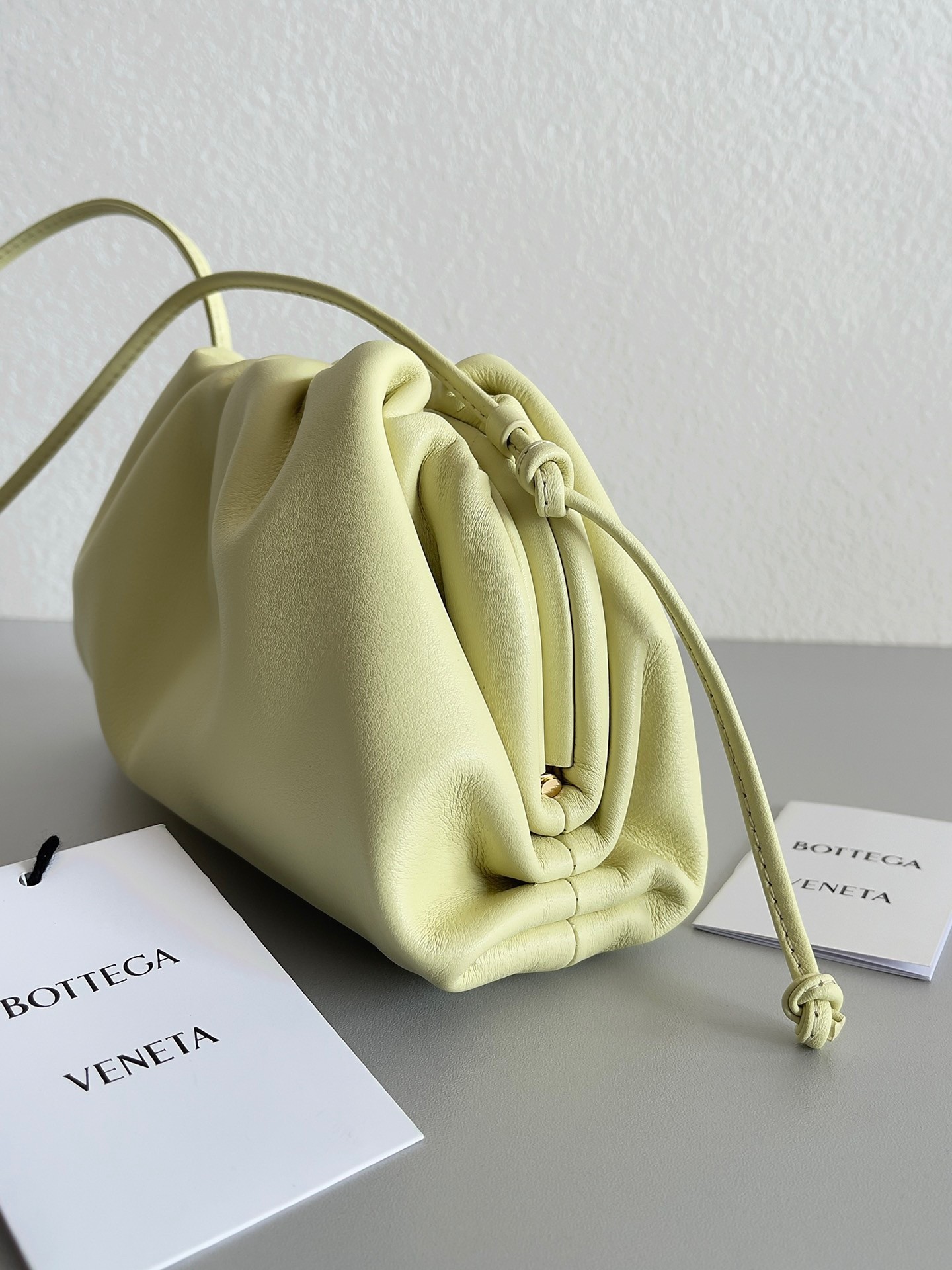 bo*te*ga Ve*ne*ta mini pouch bag in zest washed calfskin