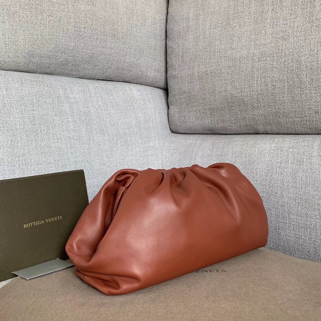 bo*te*ga Ve*ne*ta the pouch clutch in rust calfskin