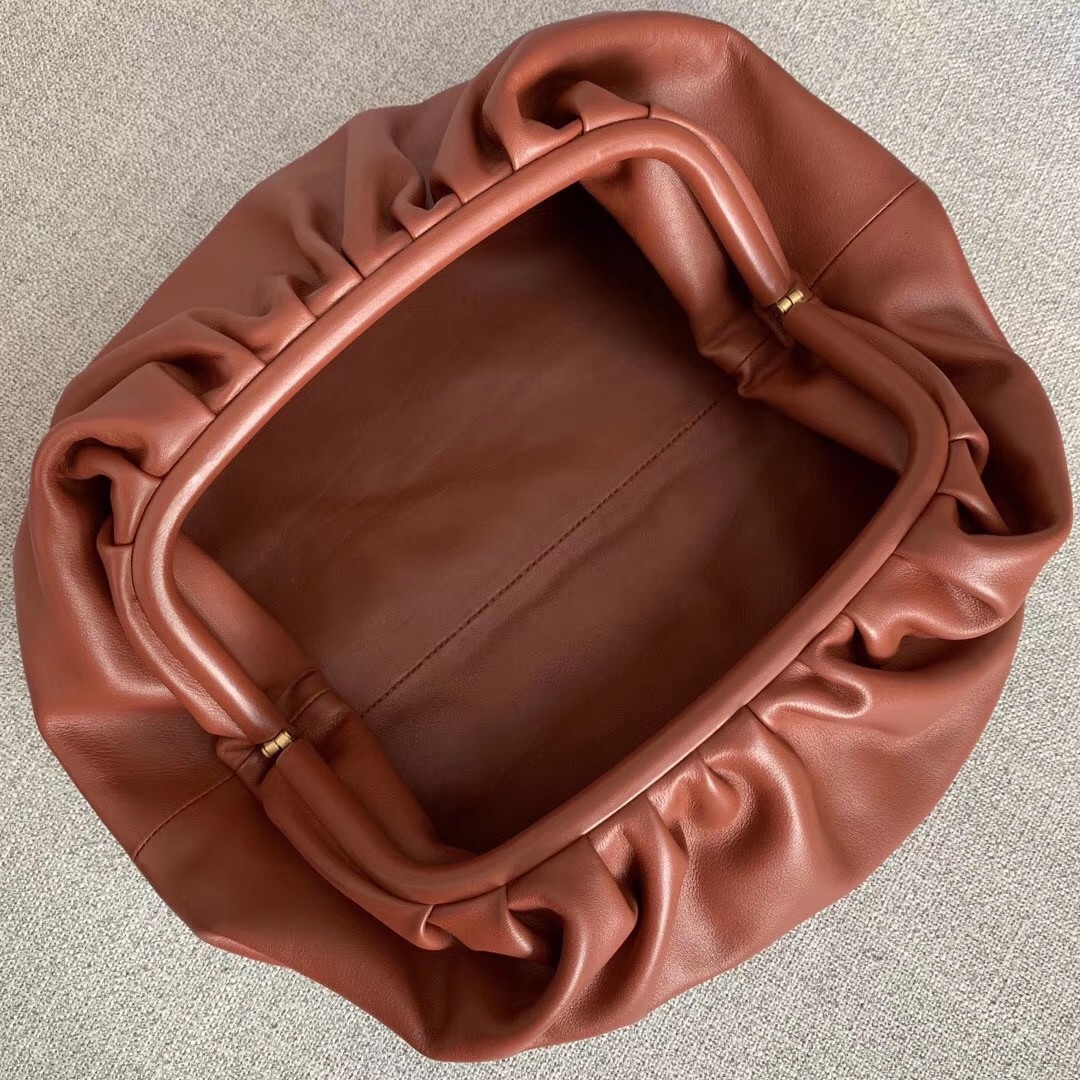 bo*te*ga Ve*ne*ta the pouch clutch in rust calfskin