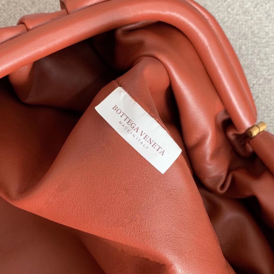 bo*te*ga Ve*ne*ta the pouch clutch in rust calfskin