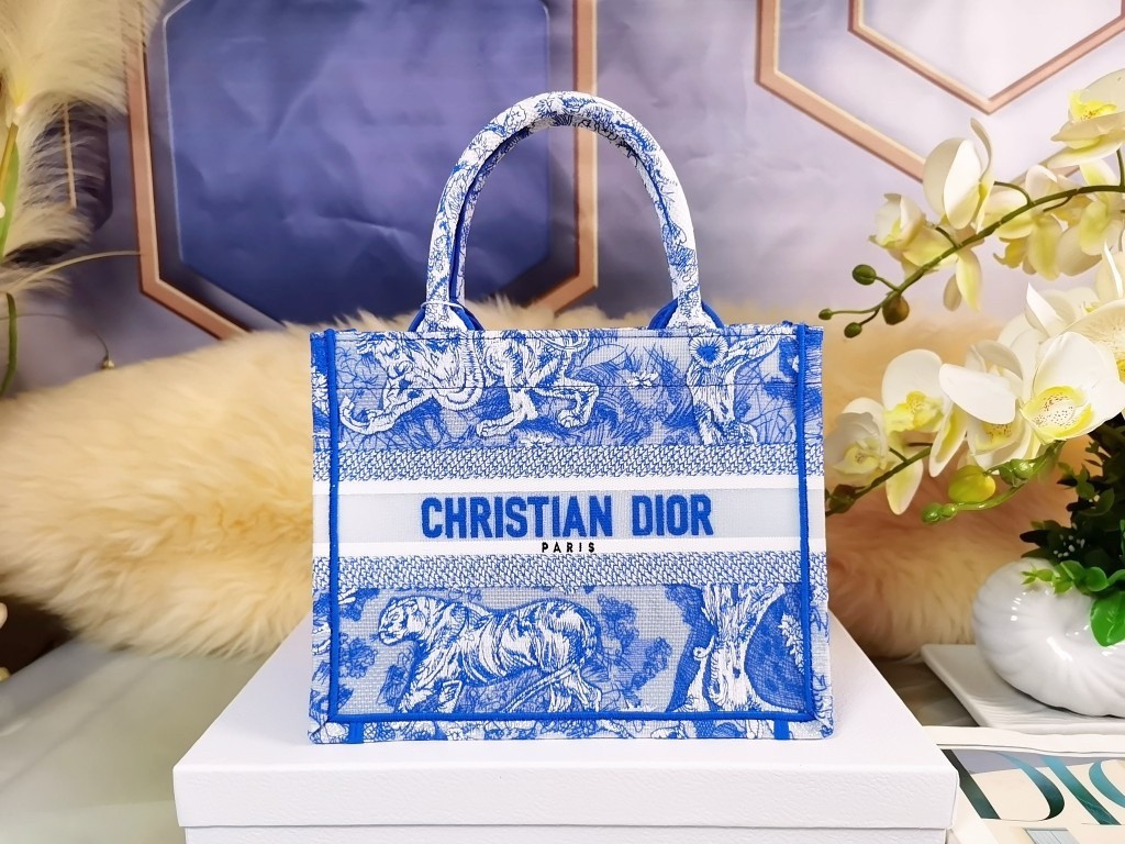 D*or small book tote bag in blue transparent toile de jouy canvas