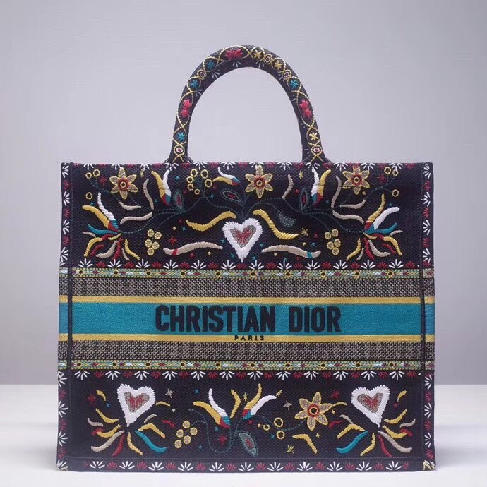 d*or book tote bag in flowers and He**ts canvas