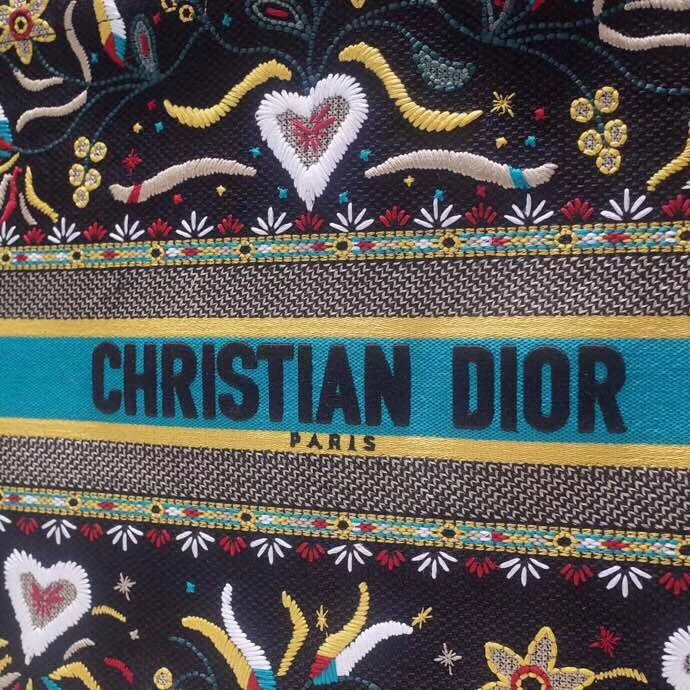 d*or book tote bag in flowers and He**ts canvas