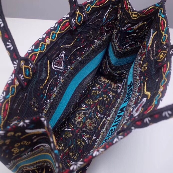 d*or book tote bag in flowers and He**ts canvas