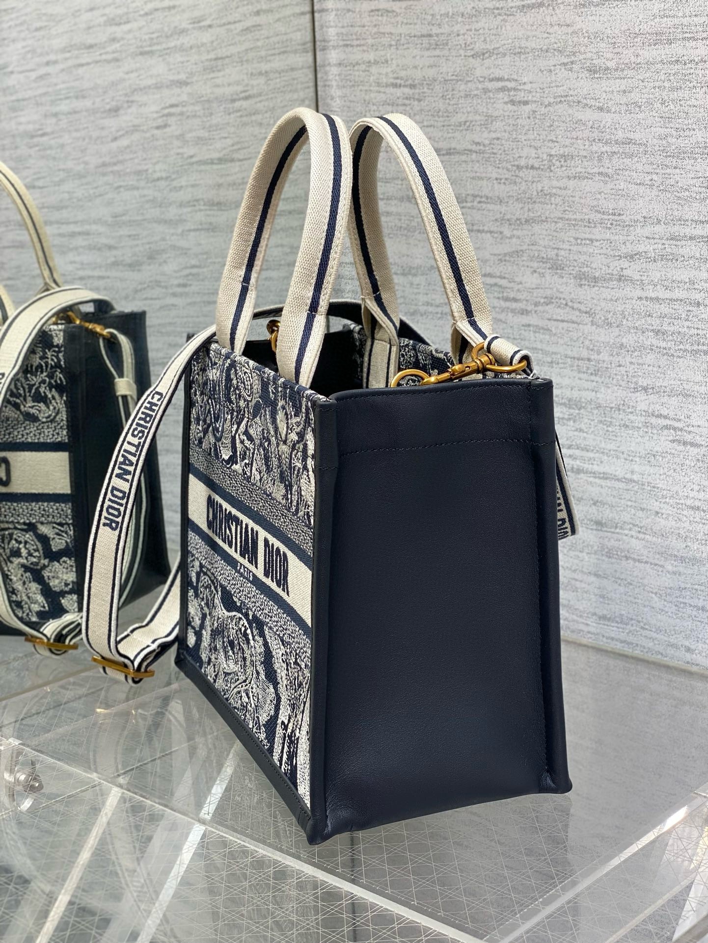 D*or medium book tote bag with strap in toile de jouy reverse embroidery