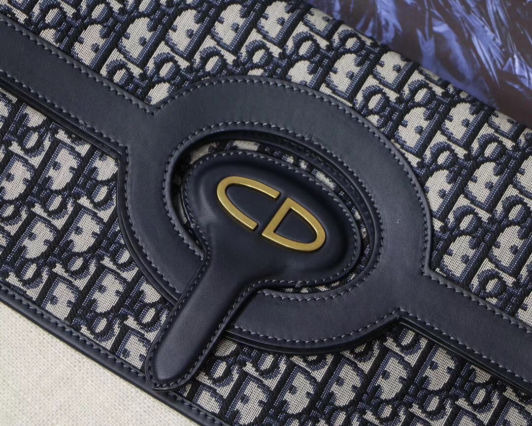 D*or fold over clutch in blue oblique canvas