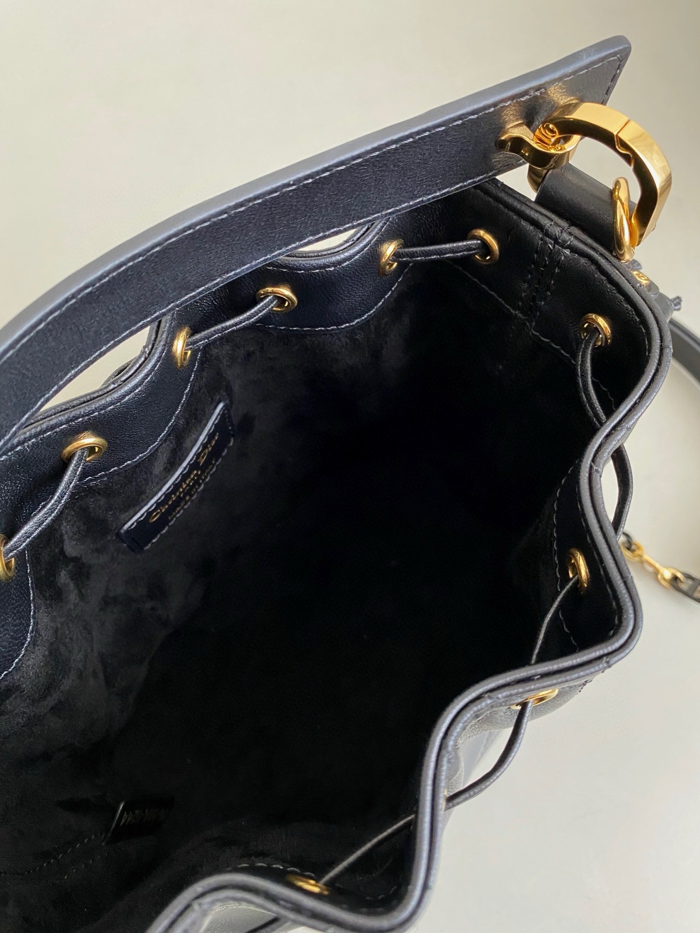 D*or small jolie bucket bag in black macrocannage lambskin
